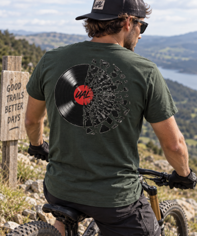 UAL Vinyl Record Back Print T-Shirt Man wearing a dark green UAL vinyl record back print T-shirt
